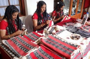 Todu tribe women performing TODA embroidery